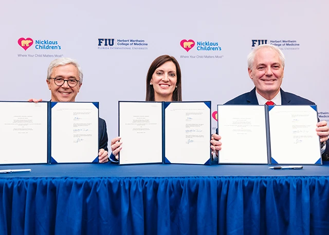 President Nunez at the signing ceremony with for FIU's partnership with Nicklaus Children's